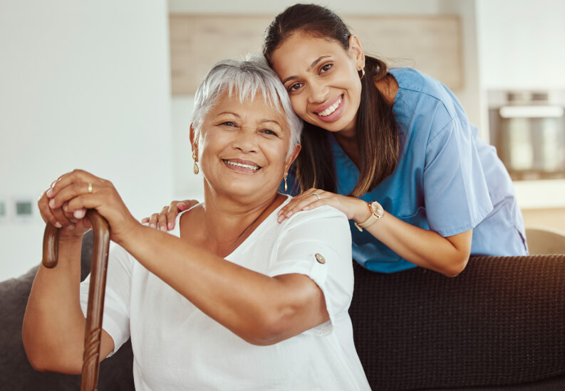 Elderly Woman Being Comforted By Skilled Nurse at Assisted Living Facility Elderly Woman Being Comforted By Skilled Nurse at Assisted Living Facility